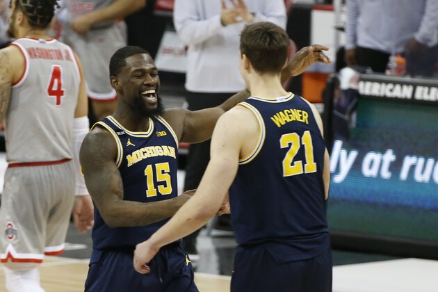 Michigan's Chaundee Brown, left, and Franz Wagner celebrates their win over Ohio State after an NCAA college basketball game Sunday, Feb. 21, 2021, in Columbus, Ohio.  (AP Photo/Jay LaPrete)