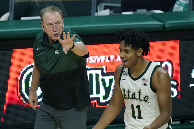 Michigan State head coach Tom Izzo directs guard A.J. Hoggard (11) during the second half of an NCAA college basketball game against Rutgers, Tuesday, Jan. 5, 2021, in East Lansing, Mich. (AP Photo/Carlos Osorio)