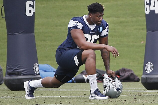 Dallas Cowboys defensive tackle David Irving (95) stretches during practice at the NFL football team's training camp in Frisco, Texas, Tuesday, June 12, 2018. (AP Photo/Brandon Wade)