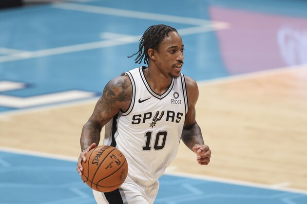 San Antonio Spurs forward DeMar DeRozan brings the ball up court against the Charlotte Hornets in the second half of an NBA basketball game in Charlotte, N.C., Sunday, Feb. 14, 2021. San Antonio won 122-110. (AP Photo/Nell Redmond)