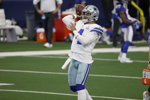 Dallas Cowboys quarterback Dak Prescott warms up before an NFL football game against the New York Giants in Arlington, Texas, Sunday, Oct. 11, 2020. (AP Photo/Ron Jenkins)