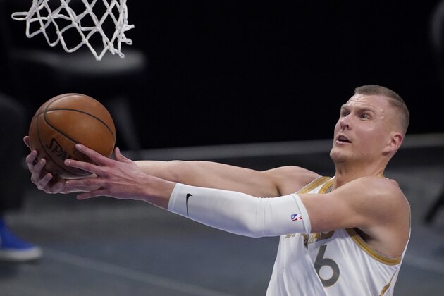 Dallas Mavericks center Kristaps Porzingis breaks to the basket for a shot during the first half of the team's NBA basketball game against the New Orleans Pelicans in Dallas, Friday, Feb. 12, 2021. (AP Photo/Tony Gutierrez)