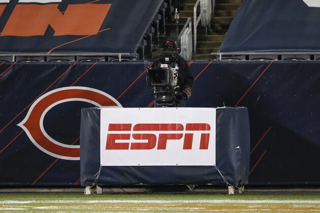 A detail view of a ESPN Monday Night Football television camera and ESPN banner is seen on the sideline during the first half of an NFL football game between the Chicago Bears and Minnesota Vikings, Monday, Nov. 16, 2020, in Chicago. (AP Photo/Kamil Krzaczynski)