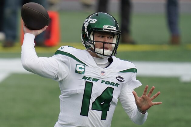 New York Jets quarterback Sam Darnold rolls out to pass against the New England Patriots in the first half of an NFL football game, Sunday, Jan. 3, 2021, in Foxborough, Mass. (AP Photo/Charles Krupa)