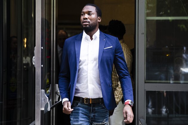 FILE - In this Aug. 6, 2019 file photo, Rapper Meek Mill departs from the criminal justice center in Philadelphia after a status hearing.  Mill is due in court Tuesday to learn if Philadelphia prosecutors will drop a 2007 case that’s kept him under court supervision for more than a decade. (AP Photo/Matt Rourke, File)