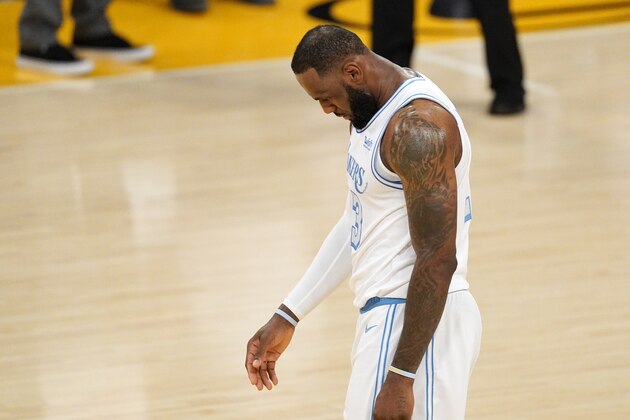 Los Angeles Lakers forward LeBron James walks the court after the Lakers turned over the ball during overtime in an NBA basketball game against the Washington Wizards Monday, Feb. 22, 2021, in Los Angeles. The Wizards won 127-124 in overtime. (AP Photo/Mark J. Terrill)