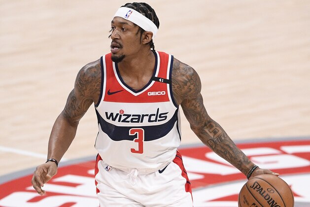 Washington Wizards guard Bradley Beal (3) dribbles the ball during the first half of an NBA basketball game against the Denver Nuggets, Wednesday, Feb. 17, 2021, in Washington. (AP Photo/Nick Wass)