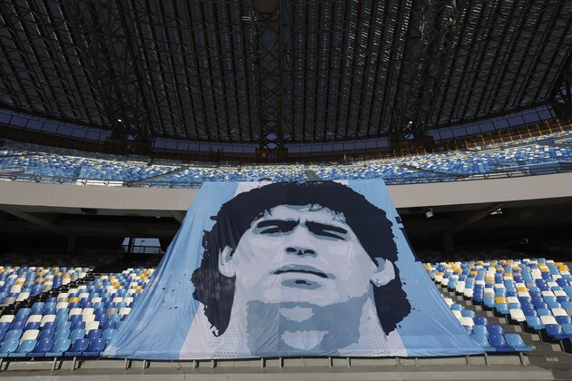 A giant portrait of Diego Armando Maradona is exposed on the stadium that was renamed after the late Argentine soccer star, in Naples, Italy, Sunday, Dec. 13, 2020, prior to the Italian Serie A soccer match between Napoli and Sampdoria. (Alessandro Garofalo/LaPresse via AP)