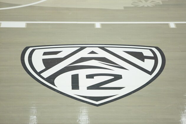 A Pac-12 Conference logo is photographed before an NCAA college basketball game between Washington State and UCLA at Beasley Coliseum in Pullman, Wash., Thursday, Feb. 11, 2021. (AP Photo/Young Kwak)