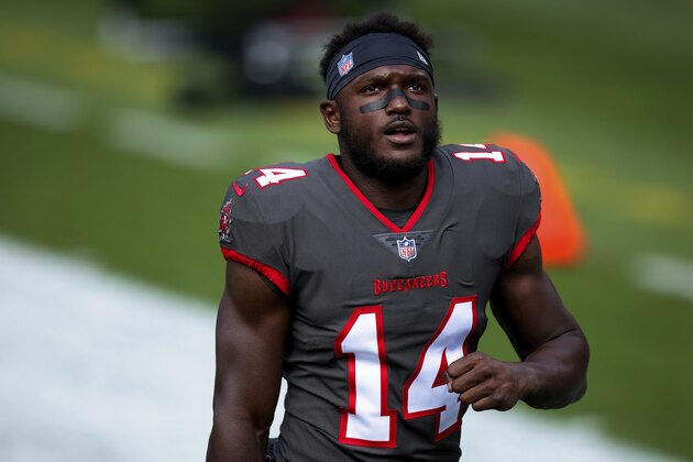 Tampa Bay Buccaneers wide receiver Chris Godwin (14) walks off the field after warming up against the Denver Broncos before NFL football game, Sunday, Sept.. 27, 2020, in Denver. (AP Photo/Justin Edmonds)