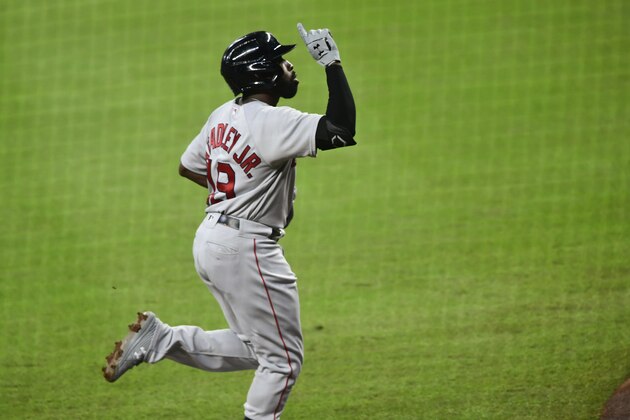 Boston Red Sox's Jackie Bradley Jr. celebrates as he runs the third base line before scoring on the Atlanta Braves during a baseball game Friday, Sept. 25, 2020, in Atlanta. (AP Photo/John Amis)