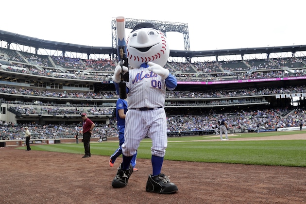 Mr Met distributes t-shirts to fans during the sixth inning of a baseball game against the Milwaukee Brewers at Citi Field Thursday, June 1, 2017, in New York. (AP Photo/Frank Franklin II)