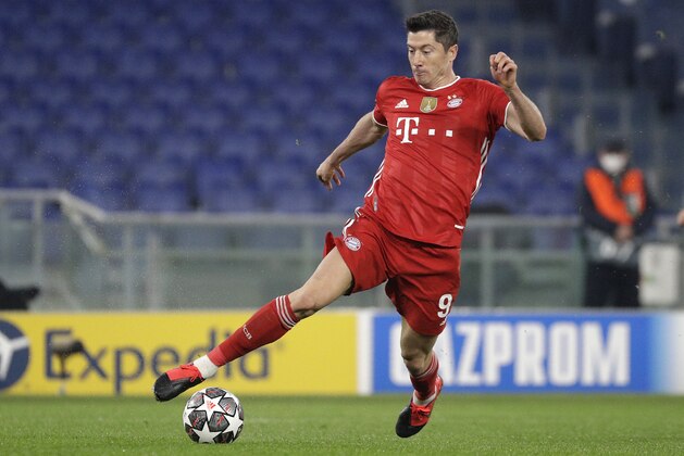 Bayern's Robert Lewandowski controls the ball during the Champions League round of 16 first leg soccer match between Lazio and Bayern Munich at the Olympic stadium in Rome, Tuesday, Feb. 23, 2021. (AP Photo/Gregorio Borgia)