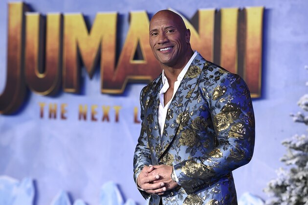 Cast member Dwayne Johnson poses for photographers at the Los Angeles premiere of