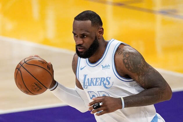 Los Angeles Lakers forward LeBron James dribbles during the first half of an NBA basketball game against the Washington Wizards Monday, Feb. 22, 2021, in Los Angeles. (AP Photo/Mark J. Terrill)
