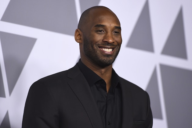 FILE - In this Monday, Feb. 5, 2018, file photo, Kobe Bryant arrives at the 90th Academy Awards Nominees Luncheon at The Beverly Hilton hotel in Beverly Hills, Calif. Peyton Manning will be doing some analysis of NFL games this season after all. ESPN and Kobe Bryant’s Granity Studios announced on Wednesday, Oct. 17, 2018, that Manning will be part of a football edition of the “Detail” franchise. The eight-episode series will be on the ESPN+ streaming service and debuts on Thursday, Oct. 18. (Photo by Jordan Strauss/Invision/AP, File)