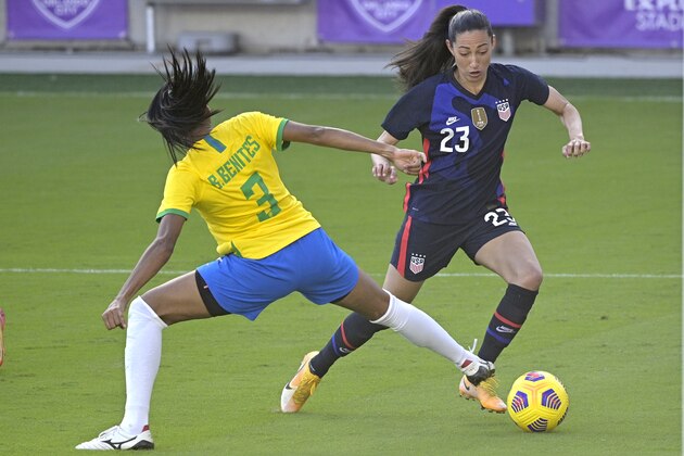 United States forward Christen Press (23) controls a ball in front of Brazil defender Bruna (3) during the second half of a SheBelieves Cup women's soccer match, Sunday, Feb. 21, 2021, in Orlando, Fla. (AP Photo/Phelan M. Ebenhack)