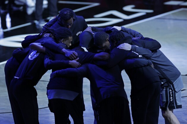 The Brooklyn Nets huddle before an NBA basketball game against the Miami Heat, Monday, Jan. 25, 2021, in New York. The Nets won 98-85. (AP Photo/Adam Hunger)