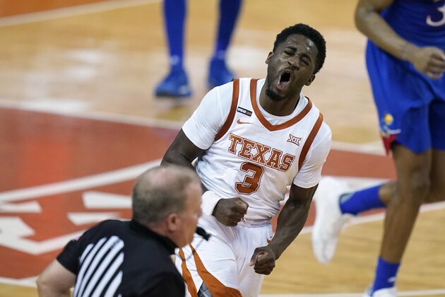Texas guard Courtney Ramey celebrates after making a basket during the second half of an NCAA college basketball game against Kansas, Tuesday, Feb. 23, 2021, in Austin, Texas. (AP Photo/Eric Gay)