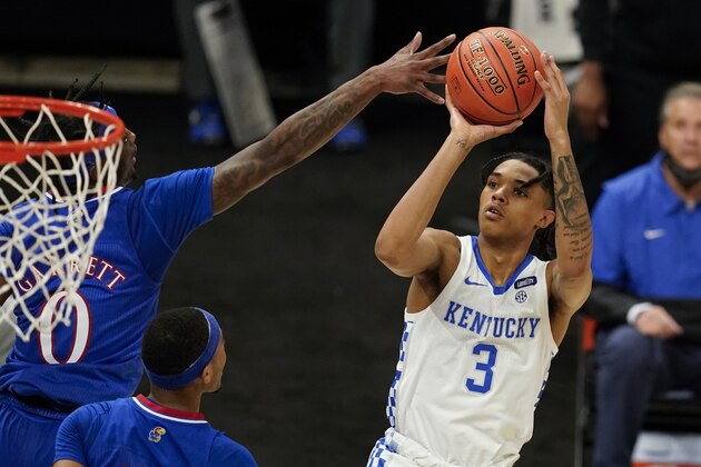 Kentucky's Brandon Boston Jr. (3) shoots against Kansas' Marcus Garrett (0) during the second half of an NCAA college basketball game Tuesday, Dec. 1, 2020, in Indianapolis. (AP Photo/Darron Cummings)
