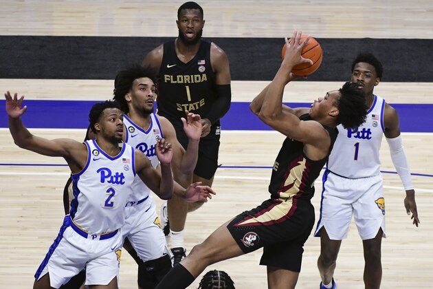 Florida State guard Scottie Barnes, second from right, shoots over Pittsburgh guard Femi Odukale (2) during the second half of an NCAA college basketball game, Saturday, Feb. 20, 2021, in Pittsburgh. (AP Photo/Fred Vuich)