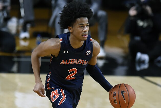 Auburn guard Sharife Cooper (2) plays against Vanderbilt during the first half of an NCAA college basketball game Tuesday, Feb. 9, 2021, in Nashville, Tenn. (AP Photo/Mark Zaleski)