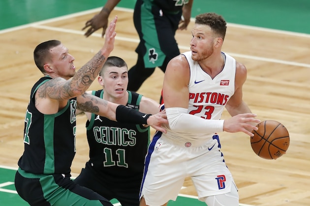 Boston Celtics' Daniel Theis (27) and Payton Pritchard (11) defend against Detroit Pistons' Blake Griffin (23) during the second half of an NBA basketball game, Friday, Feb. 12, 2021, in Boston. (AP Photo/Michael Dwyer)