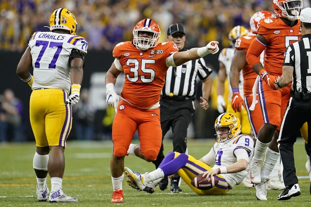 LSU quarterback Joe Burrow is sacked by Clemson defensive end Justin Foster during the first half of a NCAA College Football Playoff national championship game Monday, Jan. 13, 2020, in New Orleans.(AP Photo/David J. Phillip)