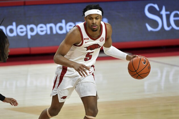 Arkansas guard Moses Moody (5) against Florida during the first half of an NCAA college basketball game in Fayetteville, Ark. Tuesday, Feb. 16, 2021. (AP Photo/Michael Woods)