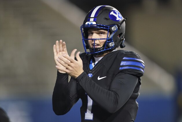 BYU quarterback Zach Wilson encourages his teammates during warmups before an NCAA college football game against San Diego State Saturday, Dec. 12, 2020, in Provo, Utah. (AP Photo/George Frey, Pool)