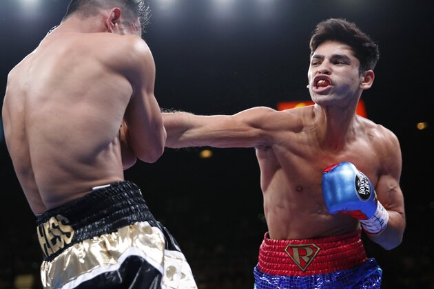 Ryan Garcia hits Romero Duno during a lightweight boxing bout Saturday, Nov. 2, 2019, in Las Vegas. (AP Photo/John Locher)