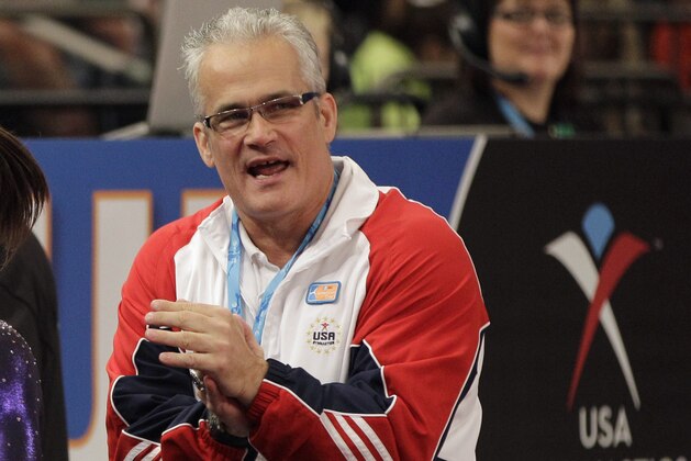 FILE - In this March 3, 2012, file photo, gymnastics coach John Geddert is seen at the American Cup gymnastics meet at Madison Square Garden in New York. Prosecutors in Michigan filed charges Thursday, Feb. 25, 2021, against Geddert, a former U.S. Olympics gymnastics coach with ties to disgraced sports doctor Larry Nassar. Geddert was head coach of the 2012 U.S. women's Olympic gymnastics team, which won a gold medal. (AP Photo/Kathy Willens, File)