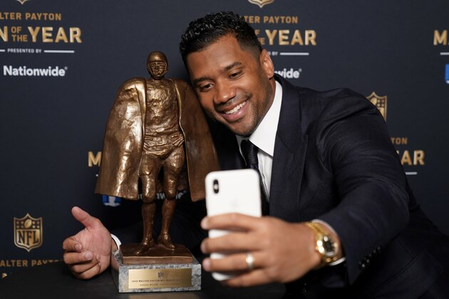 Seattle Seahawks quarterback Russell Wilson takes a selfie with his trophy after winning the Walter Payton NFL Man of the Year award during the NFL Honors ceremony as part of Super Bowl 55 Friday, Feb. 5, 2021, in Tampa, Fla. (AP Photo/Charlie Riedel) Seattle Seahawks quarterback Russell Wilson takes a selfie with his trophy after winning the Walter Payton NFL Man of the Year award during the NFL Honors ceremony as part of Super Bowl 55 Friday, Feb. 5, 2021, in Tampa, Fla. (AP Photo/Charlie Riedel)