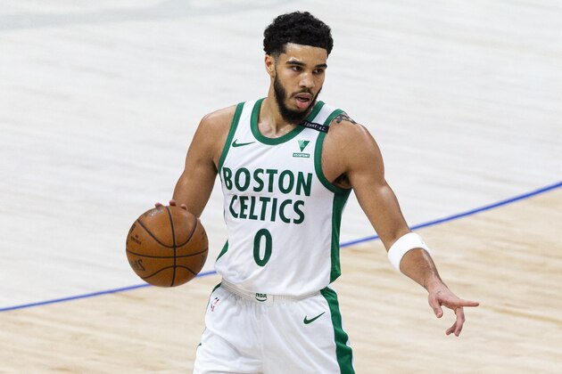 Boston Celtics forward Jayson Tatum (0) handles the ball during the first half of an NBA basketball game against the Dallas Mavericks in Dallas, Tuesday, Feb. 23, 2021. (AP Photo/Sam Hodde)