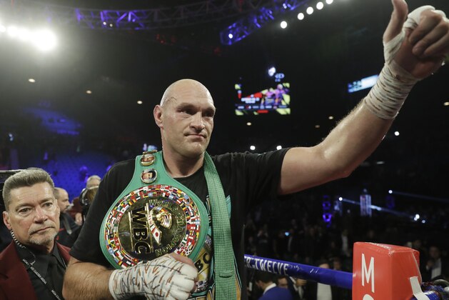 Tyson Fury, of England, celebrates after defeating Deontay Wilder during a WBC heavyweight championship boxing match Saturday, Feb. 22, 2020, in Las Vegas. (AP Photo/Isaac Brekken)
