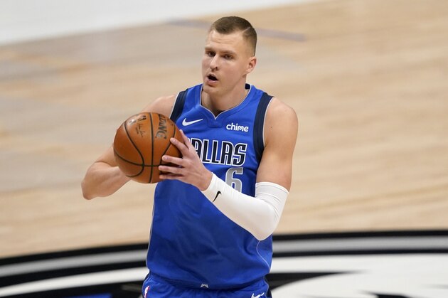 Dallas Mavericks' Kristaps Porzingis prepares for a shot attempt during an NBA basketball game against the Golden State Warriors in Dallas, Thursday, Feb. 4, 2021. (AP Photo/Tony Gutierrez)