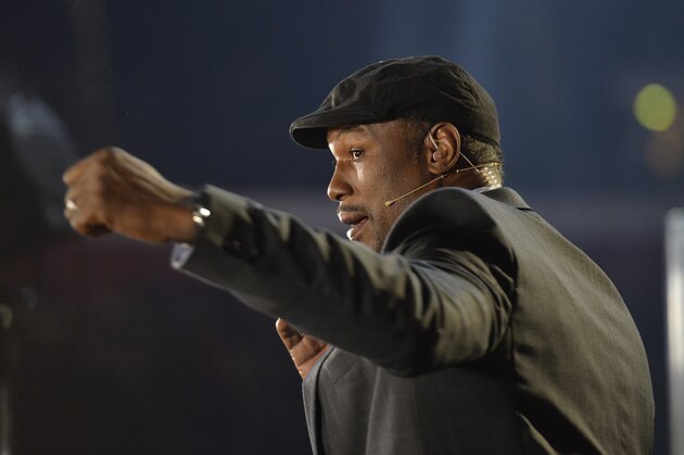 Former boxing champion Lennox Lewis demonstrates a blow as he works as a commentator prior to a world heavyweight title fight between Ukraine's Wladimir Klitschko and Britain's Tyson Fury  for Klitschko's WBA, IBF, WBO and  IBO belts in the Esprit Arena in Duesseldorf, western Germany, Saturday, Nov. 28, 2015. (AP Photo/Martin Meissner)