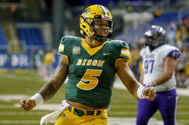 North Dakota State quarterback Trey Lance celebrates the touchdown run by Hunter Luepke against Central Arkansas in the fourth quarter of an NCAA college football game Saturday, Oct. 3, 2020, in Fargo, N.D. North Dakota State won 39-28. (AP Photo/Bruce Kluckhohn)
