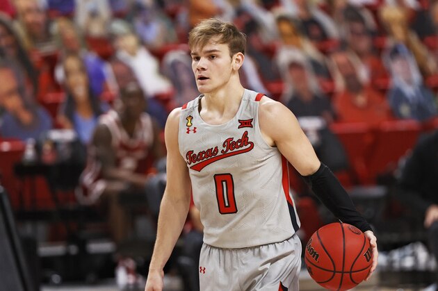 Texas Tech's Mac McClung (0) dribbles the ball during the second half of an NCAA college basketball game against Oklahoma, Monday, Feb. 1, 2021, in Lubbock, Texas. (AP Photo/Brad Tollefson)