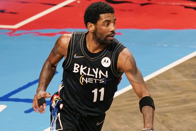 Brooklyn Nets guard Kyrie Irving (11) takes the ball up court during the first quarter of an NBA basketball game against the Orlando Magic, Thursday, Feb. 25, 2021, in New York. (AP Photo/Kathy Willens) Brooklyn Nets guard Kyrie Irving (11) takes the ball up court during the first quarter of an NBA basketball game against the Orlando Magic, Thursday, Feb. 25, 2021, in New York. (AP Photo/Kathy Willens)