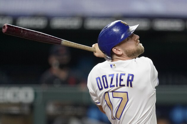Kansas City Royals' Hunter Dozier bats during the fifth inning of a baseball game against the against the Detroit Tigers Friday, Sept. 25, 2020, in Kansas City, Mo. (AP Photo/Charlie Riedel)