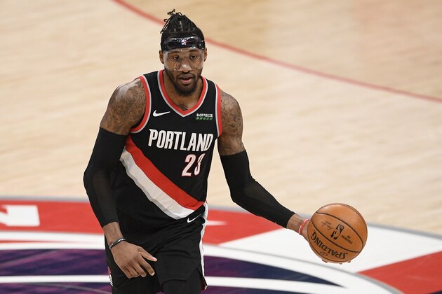 Portland Trail Blazers forward Robert Covington (23) dribbles the ball during the second half of an NBA basketball game against the Washington Wizards, Tuesday, Feb. 2, 2021, in Washington. (AP Photo/Nick Wass)