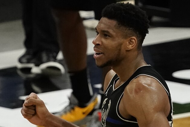 Milwaukee Bucks' Giannis Antetokounmpo reacts in the final seconds of the second half of an NBA basketball game against the LA ClippersSunday, Feb. 28, 2021, in Milwaukee. The Bucks won 105-100. (AP Photo/Morry Gash)