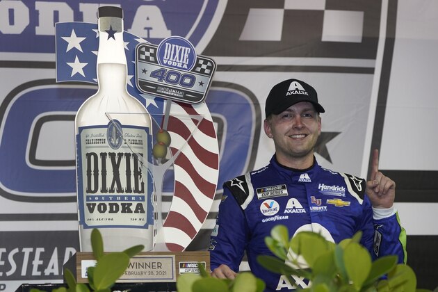 William Byron celebrates after winning a NASCAR Cup Series auto race, Sunday, Feb. 28, 2021, in Homestead, Fla. (AP Photo/Wilfredo Lee)
