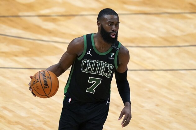 Boston Celtics guard Jaylen Brown (7) advances the ball up court in the second half of an NBA basketball game against the New Orleans Pelicans in New Orleans, Sunday, Feb. 21, 2021. (AP Photo/Gerald Herbert)