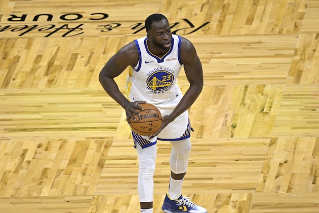 Golden State Warriors forward Draymond Green (23) passes the ball during the first half of an NBA basketball game against the Orlando Magic, Friday, Feb. 19, 2021, in Orlando, Fla. (AP Photo/Phelan M. Ebenhack)