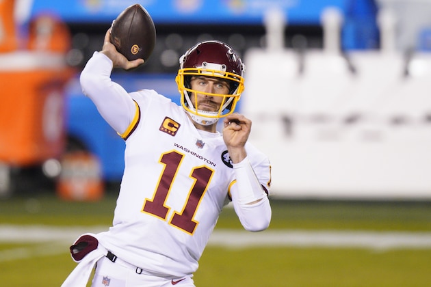 Washington Football Team's Alex Smith warms up before an NFL football game against the Philadelphia Eagles, Sunday, Jan. 3, 2021, in Philadelphia. (AP Photo/Chris Szagola)