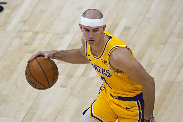 Los Angeles Lakers guard Alex Caruso (4) brings the ball up court in the second half during an NBA basketball game against the Utah JazzWednesday, Feb. 24, 2021, in Salt Lake City. (AP Photo/Rick Bowmer)