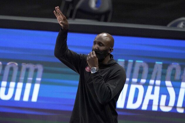 Atlanta Hawks head coach Lloyd Pierce instructs his team during an NBA basketball game against the Dallas Mavericks in Dallas, Wednesday, Feb. 10, 2021. (AP Photo/Tony Gutierrez)