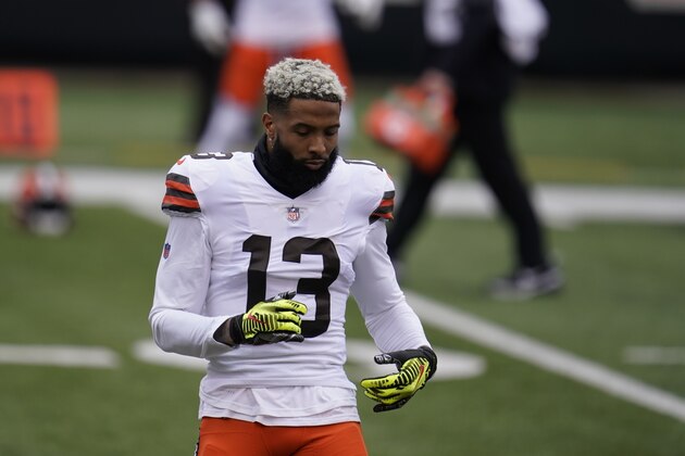 Cleveland Browns' Odell Beckham Jr. (13) stretches before an NFL football game against the Cincinnati Bengals, Sunday, Oct. 25, 2020, in Cincinnati. (AP Photo/Michael Conroy)